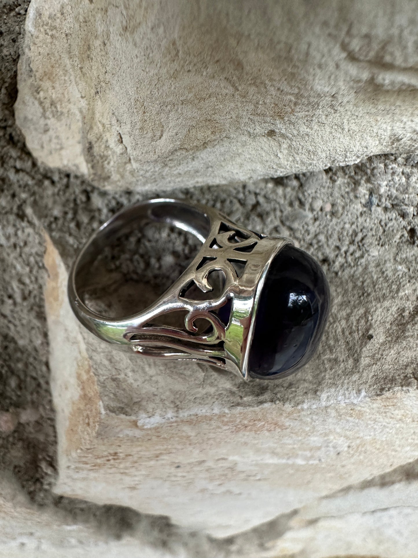 “Amethyst Whisper” Silver Ring featuring a polished deep purple amethyst and intricate silver filigree design