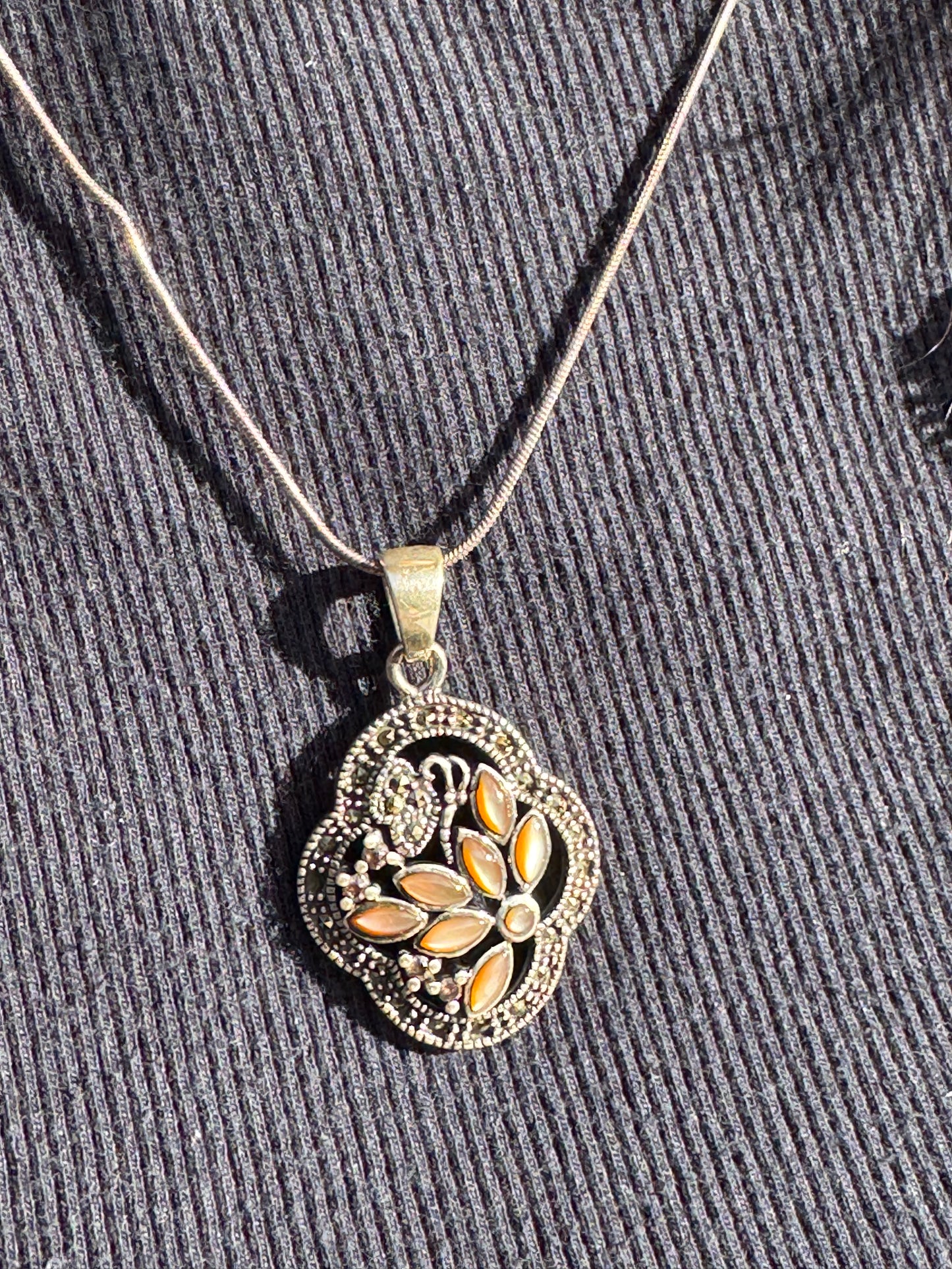 THE BROWN MOTHER OF PEARL FLOWER WITH MARCASAITE NECKLACE
