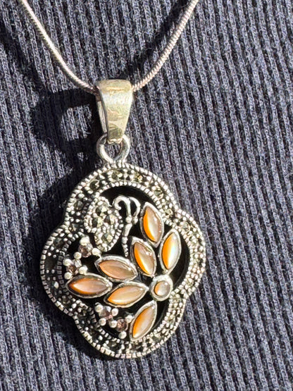THE BROWN MOTHER OF PEARL FLOWER WITH MARCASAITE NECKLACE