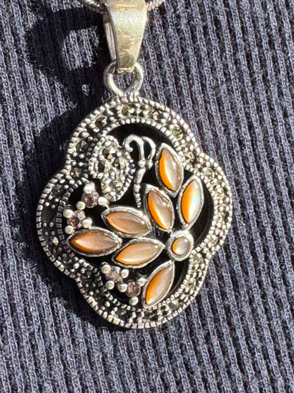 THE BROWN MOTHER OF PEARL FLOWER WITH MARCASAITE NECKLACE