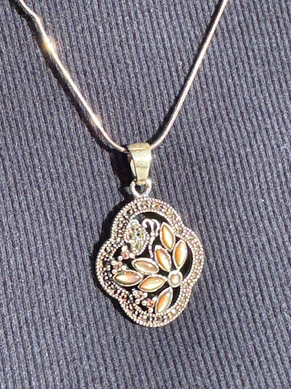 THE BROWN MOTHER OF PEARL FLOWER WITH MARCASAITE NECKLACE