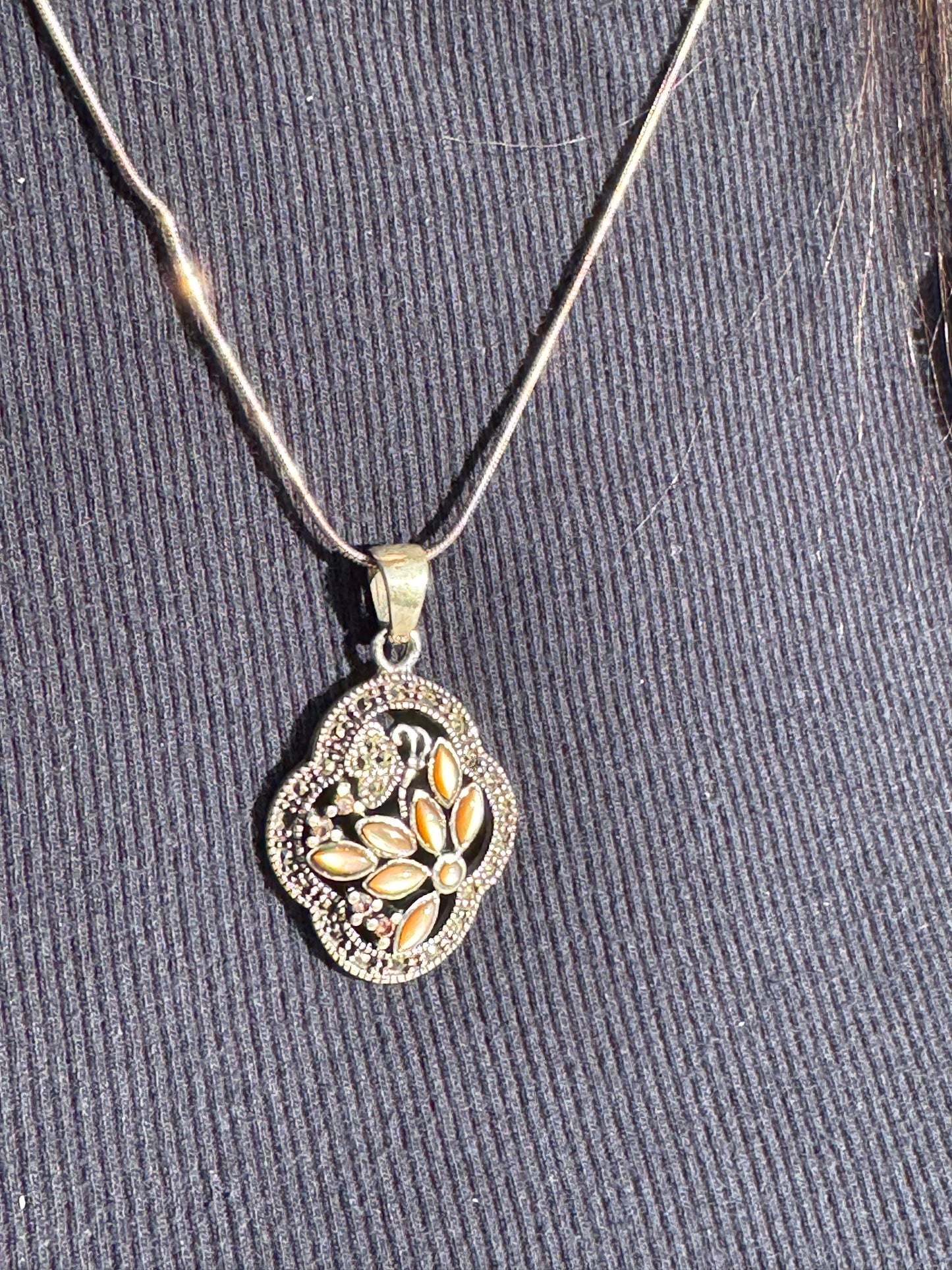 THE BROWN MOTHER OF PEARL FLOWER WITH MARCASAITE NECKLACE