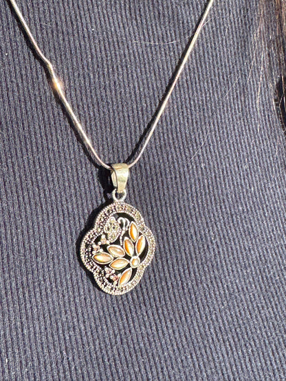 THE BROWN MOTHER OF PEARL FLOWER WITH MARCASAITE NECKLACE